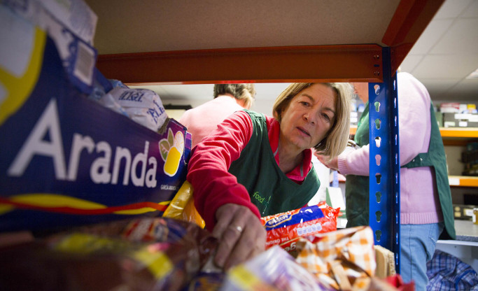 volunteers picking items for food parcel